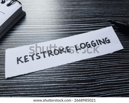 Keystroke logging writting on table background.
