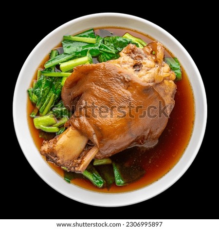Kha Moo Pa Lo, Thai food, brown Chinese stewed pork knuckle leg in sweet brown sauce isolated on black background, square ratio, top view shot