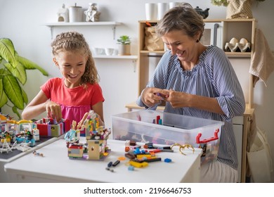 Khabarovsk, Russia, August 25, 2022. Enthusiastic Children With Mom Constructing Toy Cars, House Use Lego Classic At Home. Cute Family Playing Constructor Pieces Building Vehicle Toy