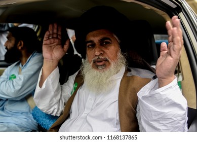 Khadim Hussain Rizvi, head of religous political party Tehreek Labaik Ya Rasool Allah, speaks to supporters during a protest against the Dutch politician Geert Wilders in Lahore, 29 August 2018.