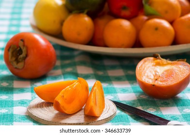 Khaki Fruit Slices On A Table