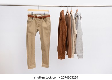 Khaki Pants Closeup With Long Sleeved Shirt On Hanging