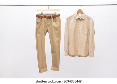 Khaki Pants Closeup With Long Sleeved Shirt On Hanging