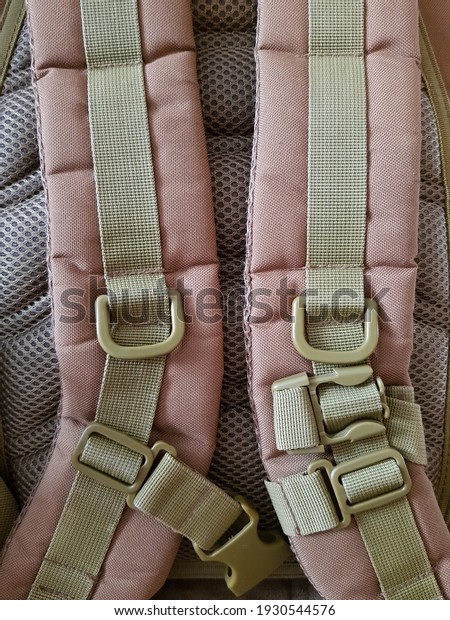 Khaki straps on the\
backpack hunting