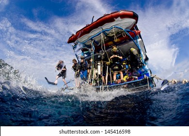 KHAO LAK, THAILAND - NOVEMBER 26: A Group Of Scuba Divers Jump In The Water From A Liveaboard Dive Boat In Similan Islands On November 26, 2010 . Similan Islands Are Thailand's Premier Diving Area.