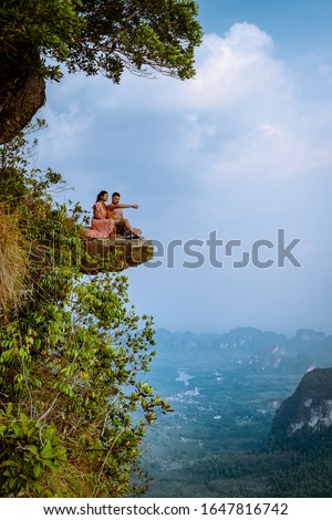 Khao Ngon Nak Nature Trail Krabi Thailand or Dragon Crest,couple men and woman climbed to a viewpoint on the top of a mountain in Krabi, Thailand