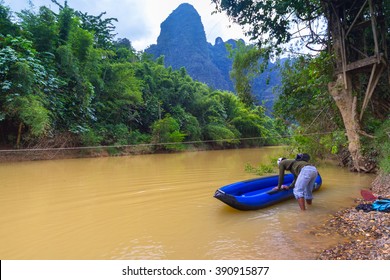 KHAO SOK, THAILAND - NOV 13, 2012: Unidentified Man At The Canoe Trip On Khao Sok National Park. The Park Is The Largest Area Of Virgin Forest In Southern Thailand, Older Than The Amazon Rain Forest.