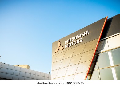 Kharkiv, Ukraine - 06 December 2020: Mitsubishi Motors Signboard Over Blue Sky Background.