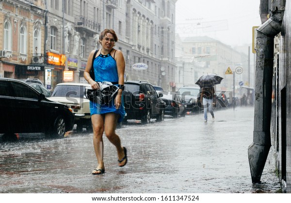 Kharkiv /\
Ukraine - August 05 2008: Rainfall in the city. Summer rain in the\
big city. Shower rain in the\
street.
