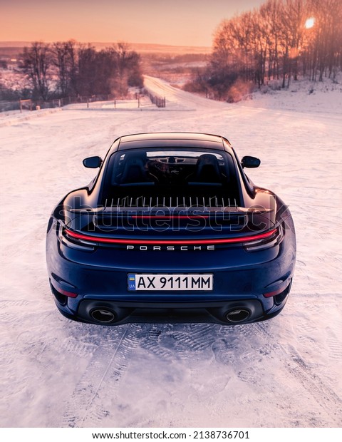 Kharkiv, Ukraine - December 2021:\
German sports car Porsche 911 Turbo S (992) in the\
snow