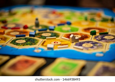 Kharkiv, Ukraine - January 05 2018: The Settlers Of Catan Board Game, Ongoing Multiple Player Game. Settlement In Focus