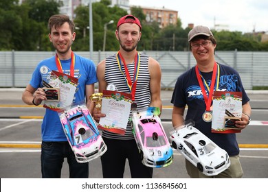 KHARKIV, UKRAINE - JULY 15, 2018: Awards Ceremony. Radio-controlled Car Movement. RC Touring Car Rally Race On The Asphalt Ground. Kharkiv RC Extreme Challenge 2018