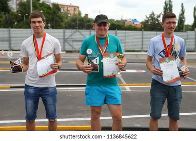 KHARKIV, UKRAINE - JULY 15, 2018: Awards Ceremony. Radio-controlled Car Movement. RC Touring Car Rally Race On The Asphalt Ground. Kharkiv RC Extreme Challenge 2018