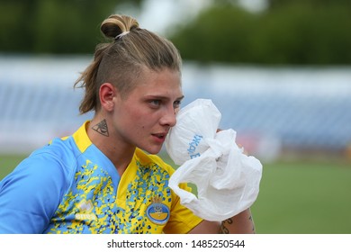 KHARKIV, UKRAINE - JULY 20, 2019: Rugby Europe Women's Sevens Grand Prix Series. Injured Player With Ice Pack Near Her Face. Scotland - Ukraine