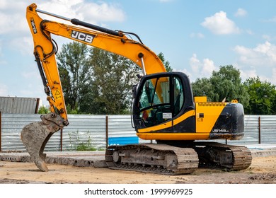 Kharkiv, Ukraine, June 28, 2021: The dirty yellow JCB crawler excavator with bucket at the construction site. Illustrative editorial.