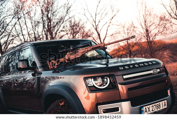 Kharkiv, Ukraine - November 2020: Brand new SUV\
Land Rover Defender on the\
hunting
