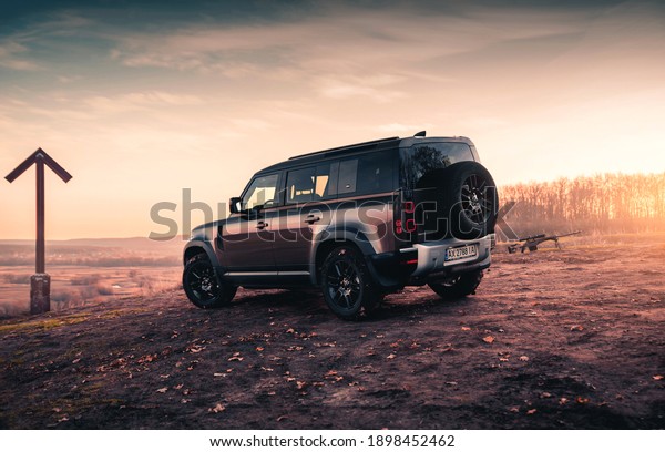 Kharkiv, Ukraine - November 2020: Brand new SUV\
Land Rover Defender on the\
hunting