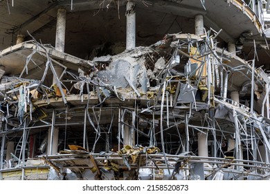 Kharkiv, Ukraine - Spring 2022: Destroyed and burned down office building as a result of air bombardment by Russian troops. War of Russia against Ukraine. Damage to civilian infrastructure.