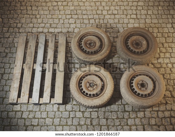 Kharkov, Ukraine - 10.13.2018: Old car tires on a\
wooden pallet