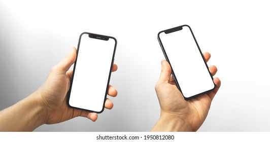 Kharkov, Ukraine - April 3, 2021: Collage With Apple IPhone 12 Mockup White Screen In Man Hands