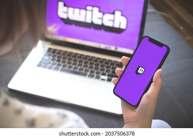 Kharkov, Ukraine - August 12, 2021: Twitch App. Woman Using Smartphone With Twitch Application. Brand Logo