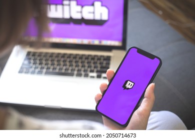 Kharkov, Ukraine - August 12, 2021: Twitch App. Woman Using Smartphone With Twitch Application. Brand Logo