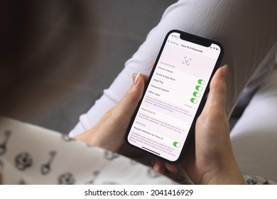 Kharkov, Ukraine - August 25, 2021: Woman Opens Face ID Settings On Apple IPhone Screen Closeup