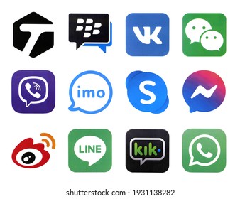 KHARKOV, UKRAINE - FEBRUARY 24, 2021: Many icons of popular social networks and messengers printed on white paper. Logos of modern communication portals and smartphone apps.