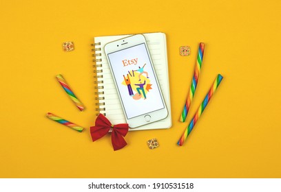 Kharkov, Ukraine - February 5, 2021: Creative Background Of Etsy Application On Apple Smartphone,e-commerce Site Of Handmade Products, Logo And Icon, Flat Lay