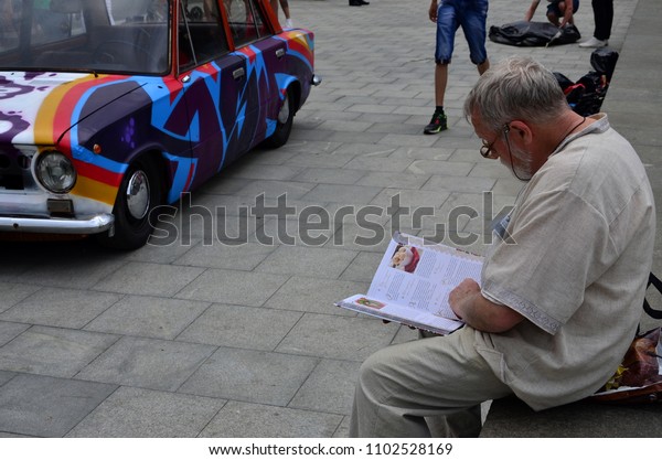 KHARKOV, UKRAINE - MAY 27, 2017: Festival of\
street art. A car that was painted by masters of street art during\
the festival. The result of the work of several graffiti artists.\
Original aerography