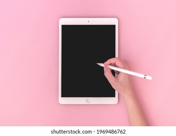 Kharkov, Ukraine - May 5, 2021: Woman Using Apple IPad With Stylus Pen, Mockup Of Digital Tablet For Artist, Top View Photo