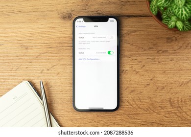 Kharkov, Ukraine - November 21, 2021: VPN Setting Screen On Apple IPhone. Wooden Table Background 