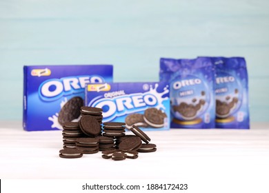 KHARKOV, UKRAINE - NOVEMBER 24, 2020: Oreo sandwich cookies and blue product boxes on white table. Oreo is a sandwich cookie with a sweet cream is the best selling cookie in the US