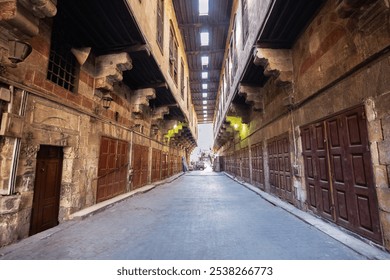 Khayamiya (Tent makers) Street in Old Cairo with its Stone Buildings, Wooden Doors, and Skylit Alleys. - Powered by Shutterstock