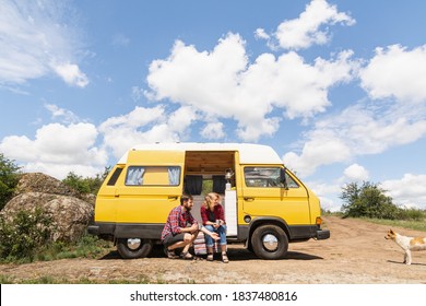 Kherson, Ukraine - June 2020: Eastern European Couple Travelling By Yellow Camper Van Though The Countryside