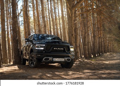 Kherson. Ukraine - May 2019: powerful American SUV Dodge Ram on a spring forest background.