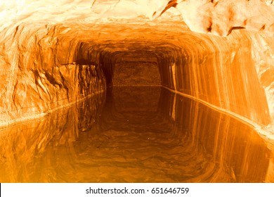 The Khewra Salt mine or Mayo salt mine in the basement mountain is dig and water inside reflect the wall is shown orange colour