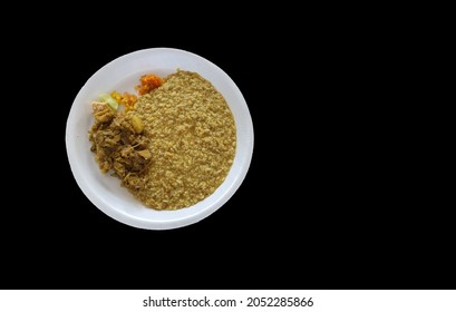 Khichri, A Bengali Porridge Vegeterian Dish On A White Plate With Black Background