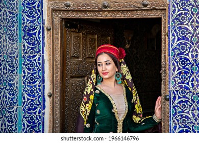 KHIVA, UZBEKISTAN - SEPTEMBER 24, 2019: Uzbek woman in traditional clothes in Khiva, Uzbekistan