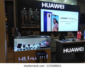 Khon Kaen, Thailand- August 29, 2018: Huawei product kiosk include a glass cabinet for display mobile phone , smart phone for customer test and a digital TV for show advertising at Central Plaza.