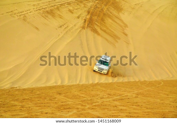 Khor al Udaid, Qatar - February 19, 2019: Offroad\
desert safari, dune bashing at inland sea near Qatar and Saudi\
Arabian, Persian Gulf, Middle East. Inland sea is a major tourist\
destination for Qatar