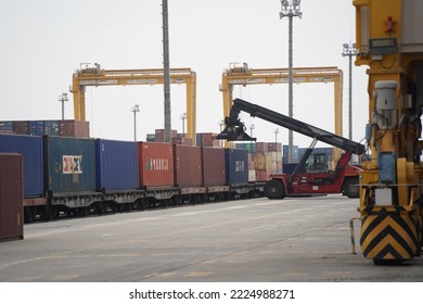 Khorgos, Kazakhstan - 09.22.2022 : Unloading of cargo containers in the dry port of Khorgos. - Shutterstock ID 2224988271