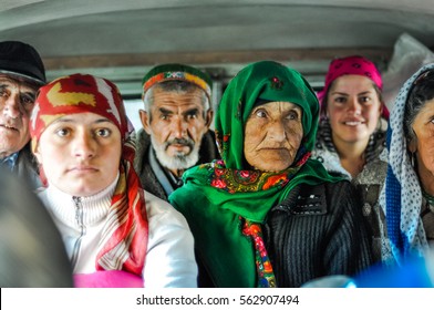 Khorog, Tajikistan - circa September 2011: People sit in car and some of them look to photocamera and smile in Khorog, Tajikistan. Documentary editorial.