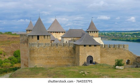 Khotyn castle in Ukraine is a powerful medieval fortress that witnessed the fighting between Poles, Cossacks and Turks. High medieval walls, towers on the background of the picturesque Dniester. - Shutterstock ID 764333791