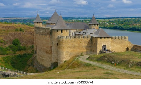 Khotyn castle in Ukraine is a powerful medieval fortress that witnessed the fighting between Poles, Cossacks and Turks. High medieval walls, towers on the background of the picturesque Dniester. - Shutterstock ID 764333794