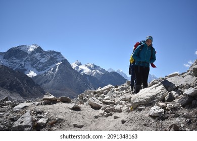 Khumbu Valley, Nepal - October 16, 2019: Young Woman Hikes A Rocky Trail In The Himalayan Mountain Range On The Way To Everest Base Camp