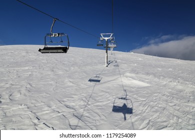 ki lift on the background of a snowy slope - Shutterstock ID 1179254089