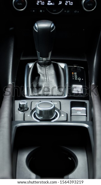 Kia auto gear shift\
knob in dark tones