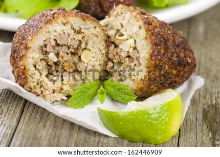 Kibbeh - Middle Eastern minced meat and bulghur wheat fried snack. Also popular party dish in Brazil (kibe). [[stock_photo]] © 