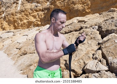 Kick boxer fighter preparing for combat or training. - Powered by Shutterstock